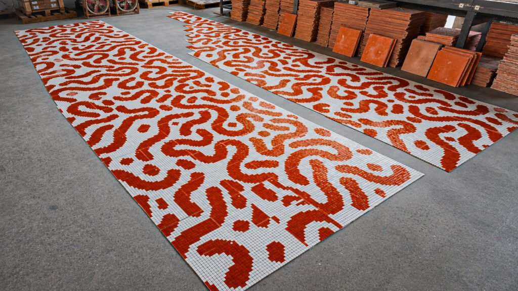 Complete sections of the pool mosaic ready for delivery.