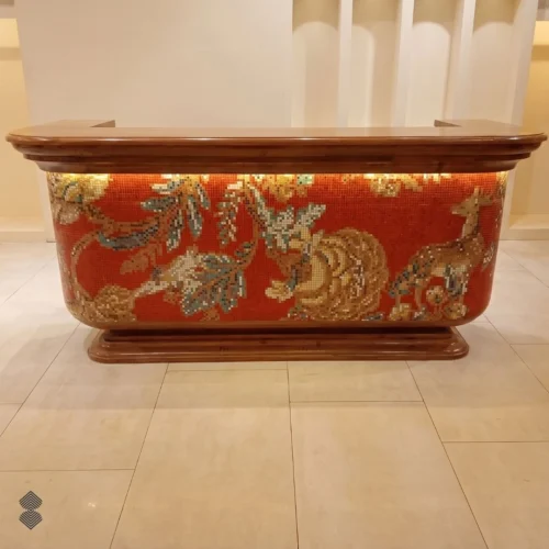 Handcrafted wildlife mosaic bar with stylized deer, botanical motifs, and warm amber details on red background.
