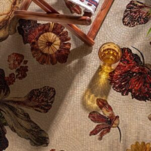 A floral walkway mosaic with rust and amber blossoms set into a pale stone ground.