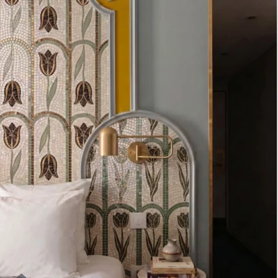 Handcrafted tulip mosaic featuring repeating arches, floral motifs, sage green, brown, and ivory tones.