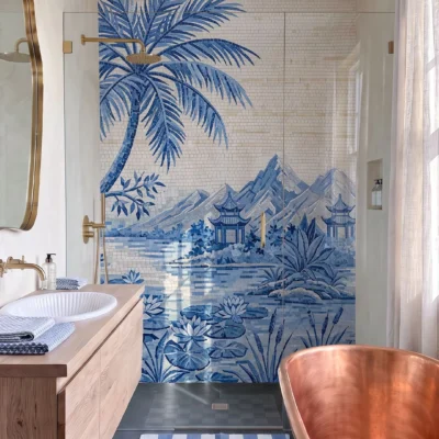 Luxury blue mosaic shower wall featuring palm trees, lotus flowers, mountains, water, and Asian-inspired pavilions in a botanical bathroom.