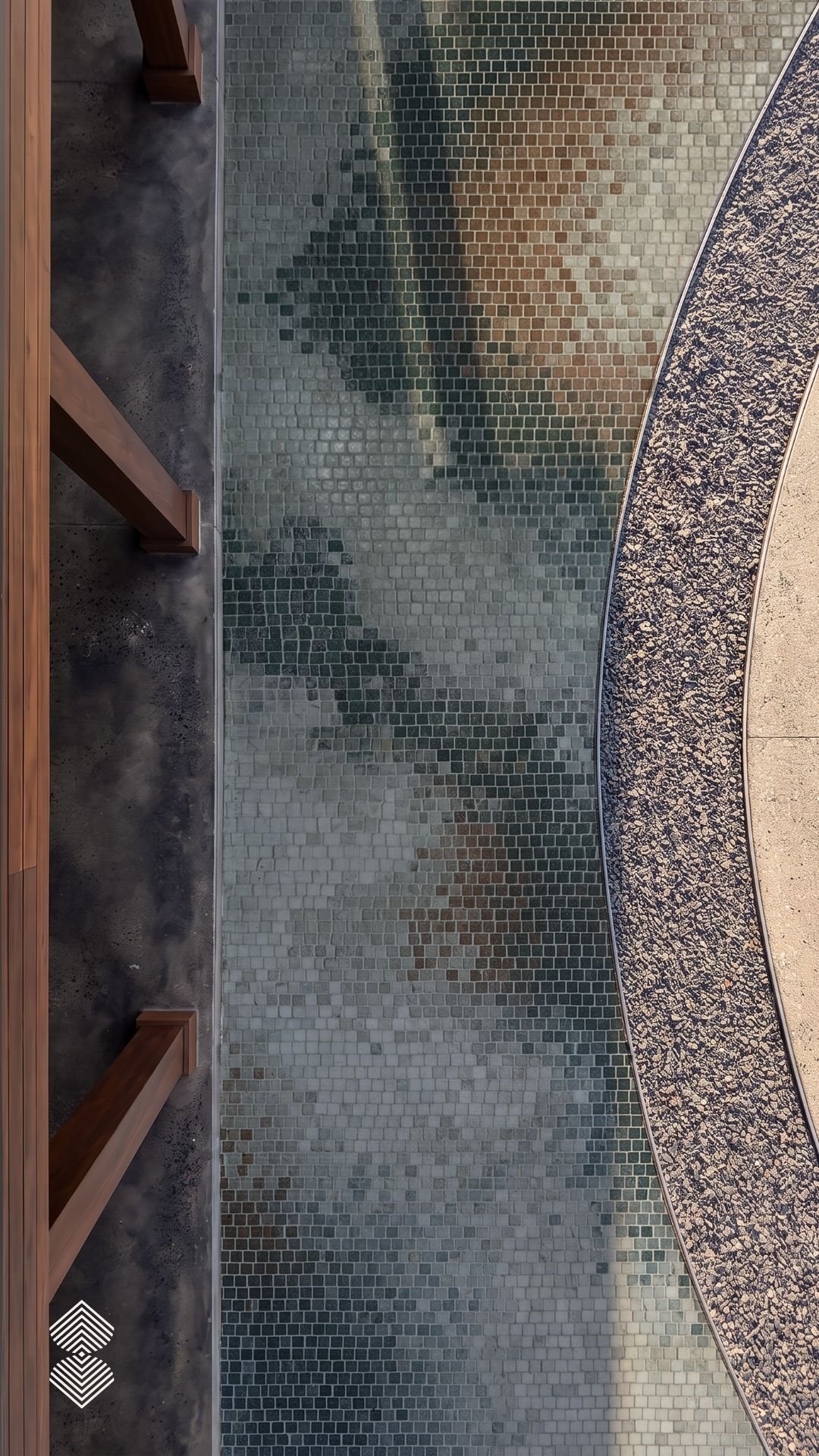 High-angle view of a contemporary mosaic tile floor with subtle gradient tones, curved borders, and dark wooden structural beams.