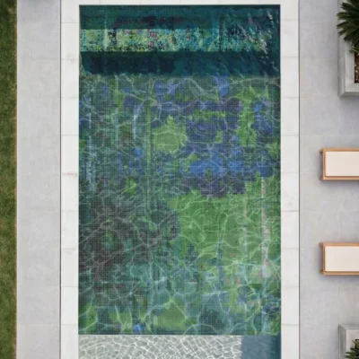 Fissure pool mosaic is a glass mosaic pool featuring layered emerald, teal, turquoise and deep blue tones in an abstract underwater design.