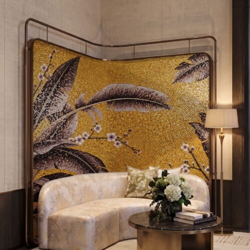 A curved gold mosaic wall panel showing large banana leaves and cherry blossom branches in a banana leaf mosaic mural.