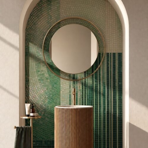 Green arch bathroom mosaic wall made of small glass tesserae in a curved niche.