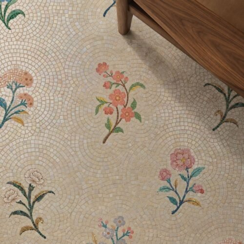 A framed mosaic panel of scattered floral sprigs installed as a shower wall feature.