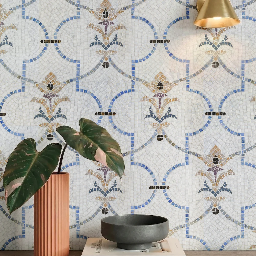 Floral mosaic tile pattern with ivory, blue, terracotta, and charcoal accents inspired by Mediterranean and Islamic artistry.