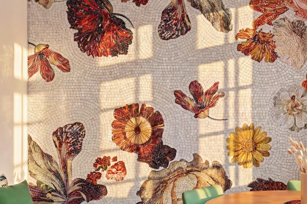 Handcrafted floral mosaic featuring oversized autumn flowers in rich burgundy, gold, and ivory tones creating a luxury feature wall.