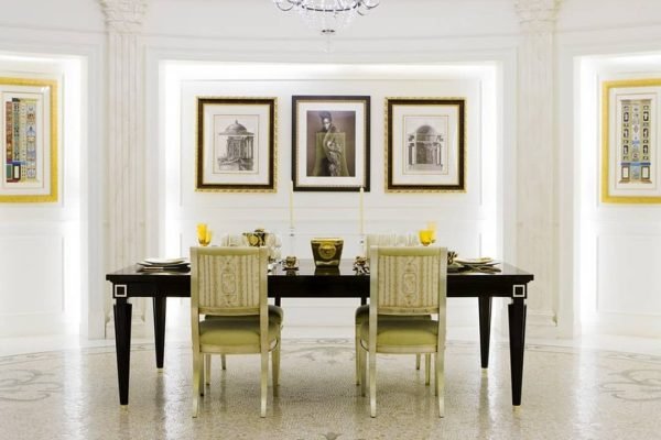 Elegant dining room with chandelier, framed art, and handcrafted imperial mosaic floor design in classic floral patterns, created by MEC Artworks.